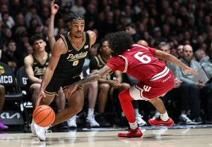 C.J. Cox (0) drives past Indiana Hoosiers guard Tayton Conerway