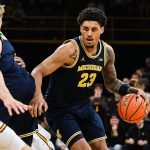 Yaxel Lendeborg controls the ball against the Iowa Hawkeyes