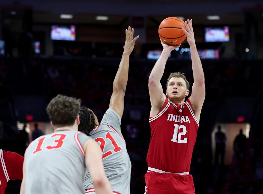 Tucker Devries shoots the ball as Ohio State Buckeyes forward Devin Royal defends
