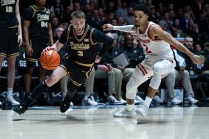 Braden Smith drives to the basket around Wisconsin Badgers guard Nick Boyd