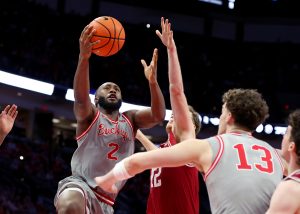 Buckeyes guard Bruce Thornton drives to the basket as Hoosiers guard Lamar Wilkerson defends