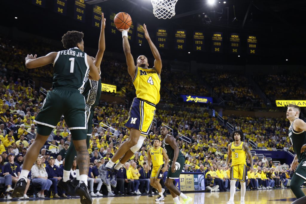 Nimari Burnett shoots on Michigan State guard Jeremy Fears Jr.