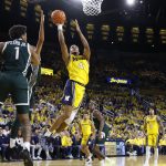 Nimari Burnett shoots on Michigan State guard Jeremy Fears Jr.