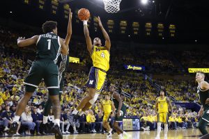 Nimari Burnett shoots on Michigan State guard Jeremy Fears Jr.
