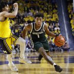 Jeremy Fears Jr. dribbles defended by Michigan Wolverines guard Elliot Cadeau
