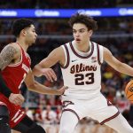 Nick Boyd (2) defends against Illinois Fighting Illini guard Keaton Wagler.