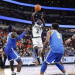 Kur Teng shoots against the UCLA Bruins.