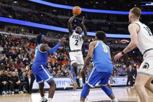 Kur Teng shoots against the UCLA Bruins.