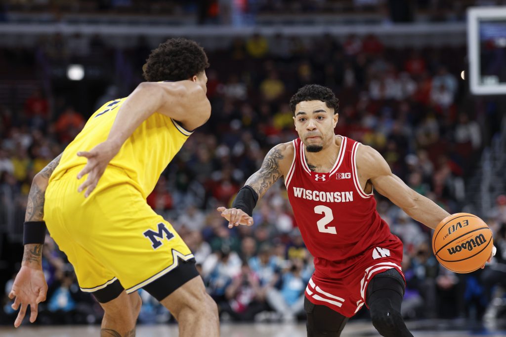 Nick Boyd drives to the basket against the Michigan Wolverines.