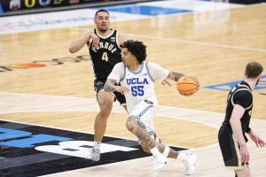 Skyy Clark drives to the basket against Purdue forward Trey Kaufman-Renn.