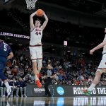 Illinois Fighting Illini center Zvonimir Ivisic dunks the ball against the Penn Quakers.