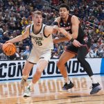 Michigan State Spartans center Carson Cooper drives to the basket in the second half against the Louisville Cardinals.