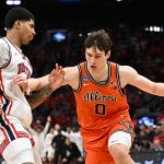 Illinois Fighting Illini forward David Mirkovic dribbles the ball against Houston Cougars center Chris Cenac Jr.