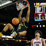 Michigan Wolverines guard Roddy Gayle Jr. dunks against the Arizona Wildcats.