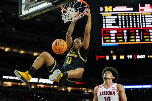 Michigan Wolverines guard Roddy Gayle Jr. dunks against the Arizona Wildcats.