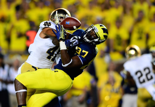 Sep 7, 2013; Ann Arbor, MI, USA; Michigan Wolverines tight end Devin Funchess (87) is unable to make a catch while being defended by Notre Dame Fighting Irish safety Matthias Farley (41) during the fourth quarter at Michigan Stadium. Mandatory Credit: Andrew Weber-USA TODAY Sports