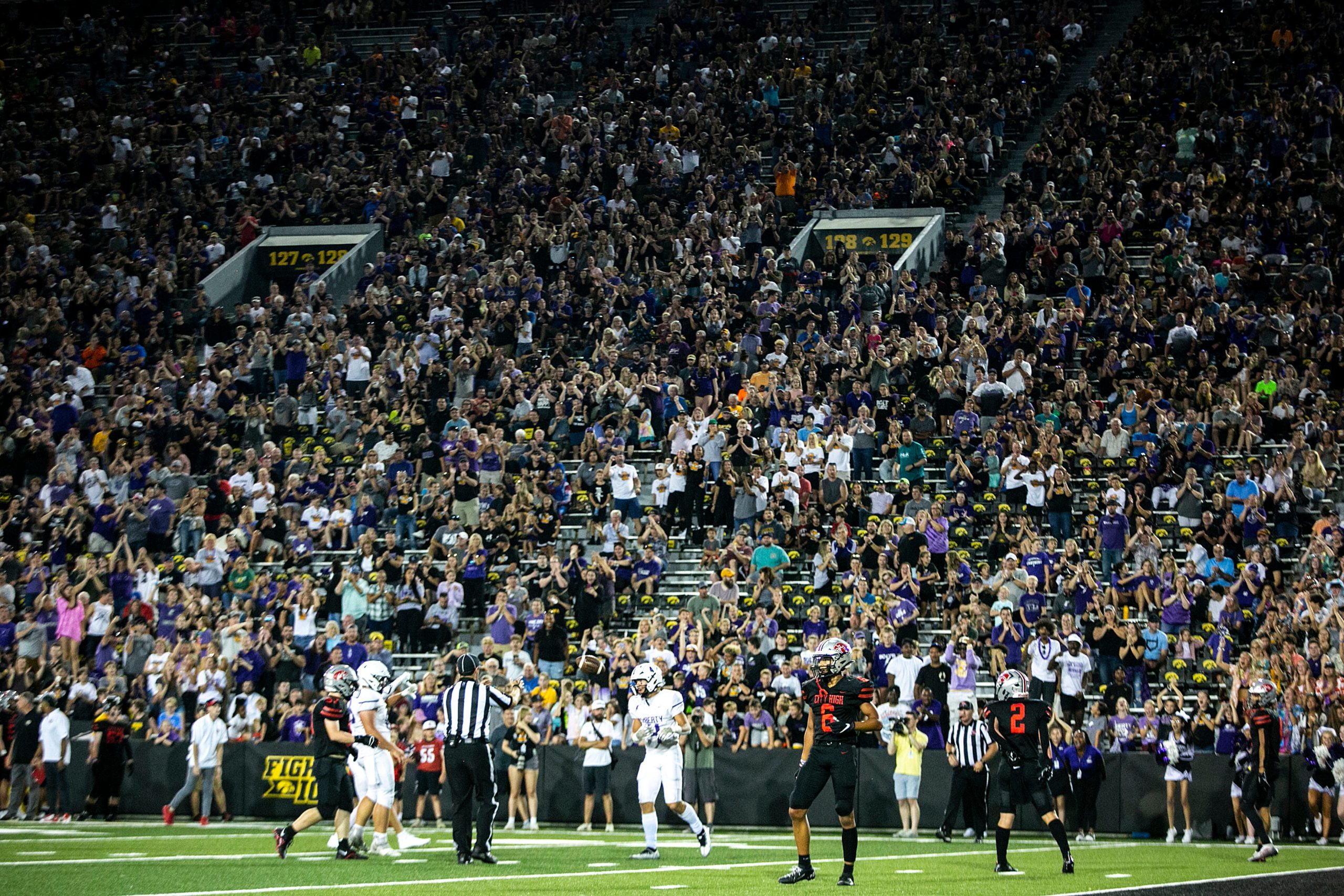 Iowa City high schools do the Iowa Wave in 'Clash at Kinnick'